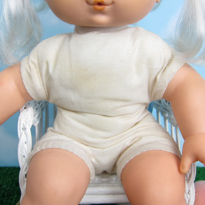 Strawberry Shortcake Apricot Baby Blow Kiss doll with stains on body
