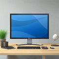 A Dell 2407WFP 19" 1920x1080 monitor displays a blue screen on a wooden desk with a potted plant, tablet, keyboard, mouse, and decor in a minimalist office setup.